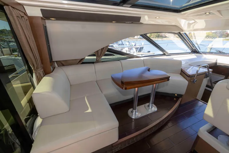 Slide: The Image of Luxurious interior of 2016 Sea Ray 510 Sundancer yacht with elegant seating and table. - 46
