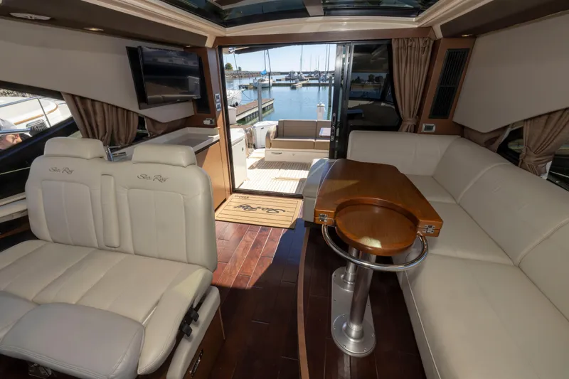 Slide: The Image of Luxurious interior of 2016 Sea Ray 510 Sundancer yacht with elegant seating and waterfront view. - 47