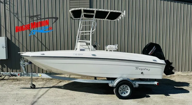 The Image of 2025 Bayliner Trophy T18 boat on trailer, parked outdoors. - 0