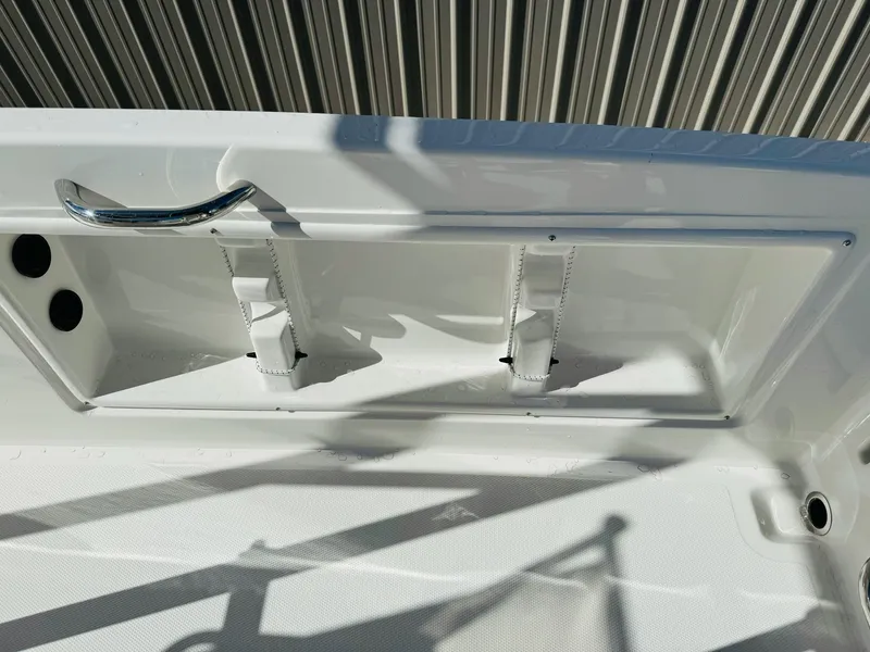 Slide: The Image of 2025 Bayliner Trophy T18 boat interior detail with white finish and metal handle. - 10