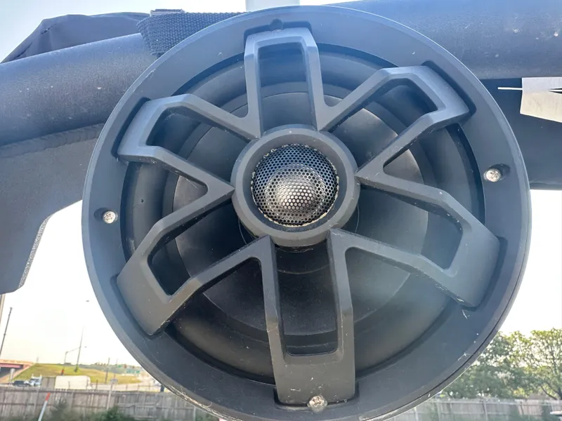 Slide: The Image of 2022 Axis A22 boat speaker, close-up view, outdoor setting. - 14