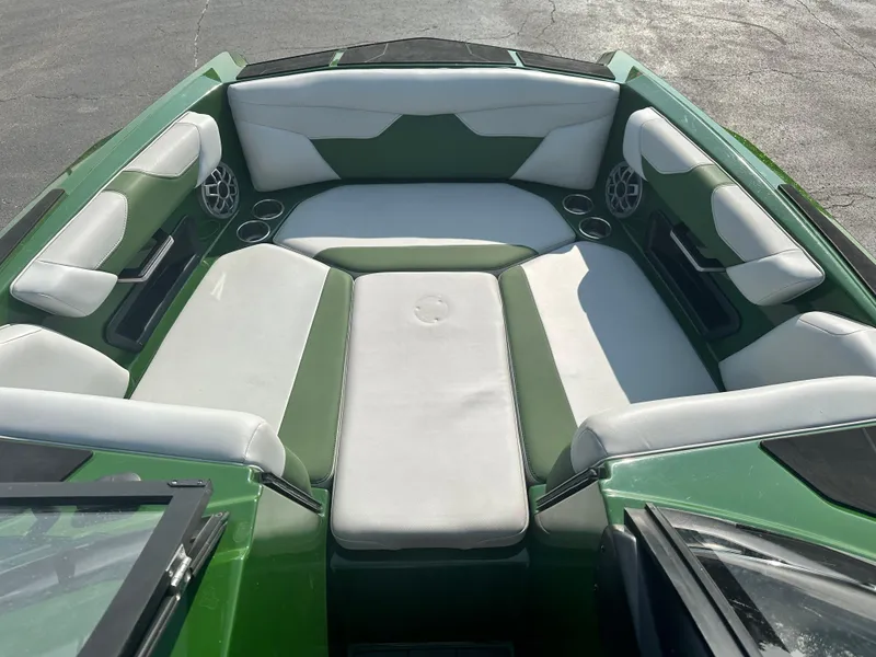 Slide: The Image of 2022 Axis A22 boat interior with green and white seating. - 15