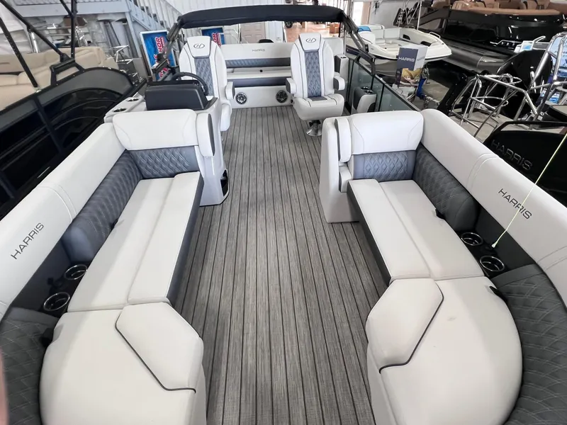 Slide: The Image of 2024 Harris Sunliner 230 pontoon boat interior with luxurious seating and modern design. - 5