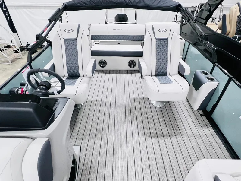 Slide: The Image of 2024 Harris Sunliner 230 boat interior with modern seating and sleek design. - 6