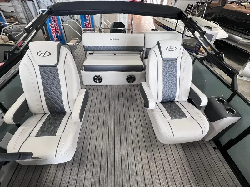 Slide: The Image of 2024 Harris Sunliner 230 boat interior with luxury seating and modern design. - 7