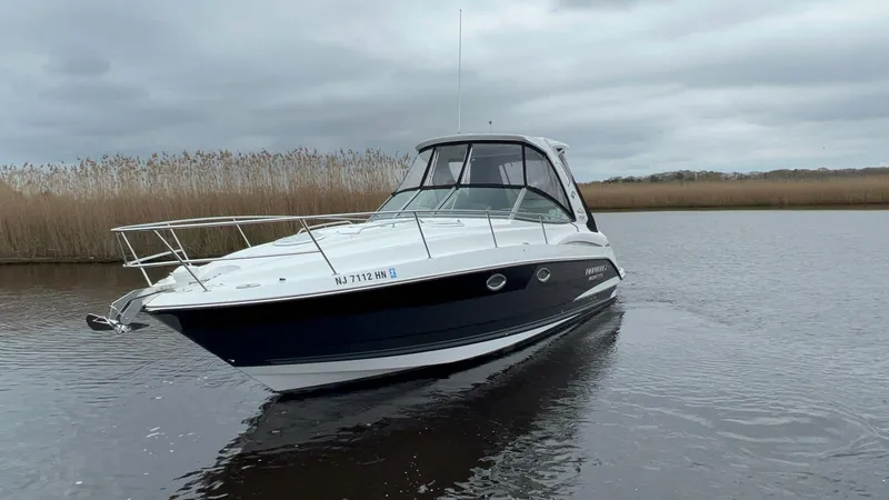 Slide: The Image of 2020 Monterey 345 SY boat on calm water under cloudy skies. - 11