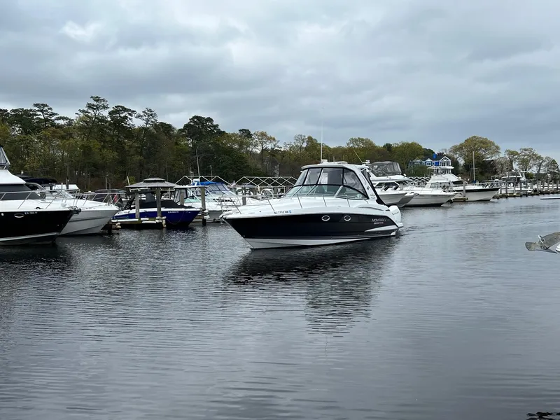 Slide: The Image of 2020 Monterey 345 SY boat docked in a serene marina setting. - 14