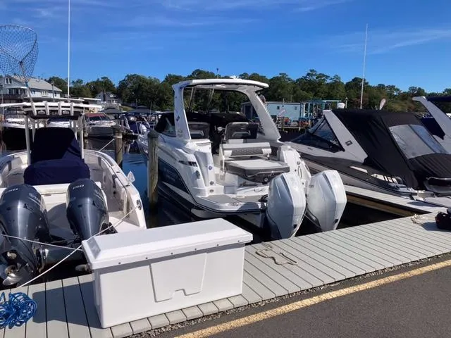 Slide: The Image of 2020 Monterey 345 SY boat docked at marina with clear blue sky. - 19