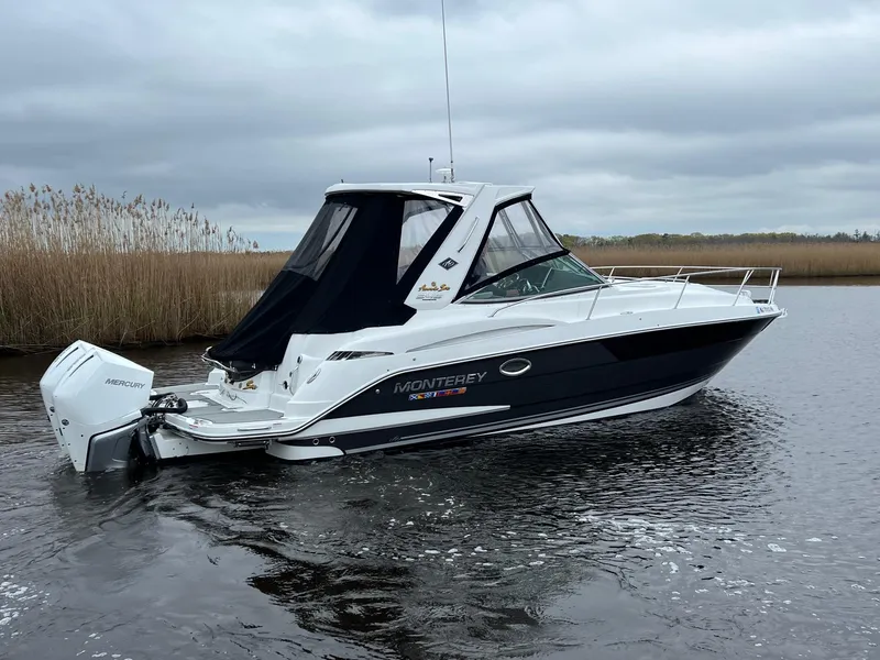 Slide: The Image of 2020 Monterey 345 SY boat on calm water with overcast sky. - 2