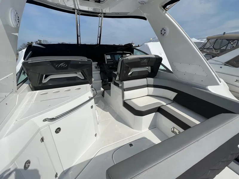 Slide: The Image of 2020 Monterey 345 SY boat interior with modern seating and dashboard. - 20