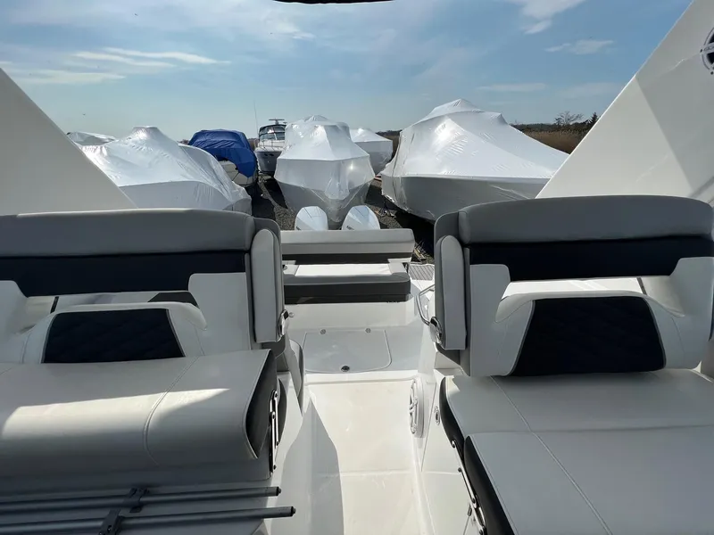 Slide: The Image of 2020 Monterey 345 SY boat interior with covered boats in background. - 23
