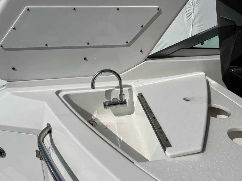 Slide: The Image of Monterey 345 SY 2020 boat sink with faucet, sleek white design. - 31