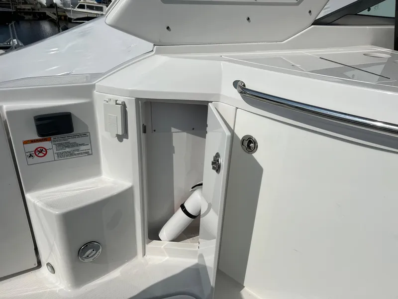 Slide: The Image of 2020 Monterey 345 SY boat deck with open storage compartment. - 32