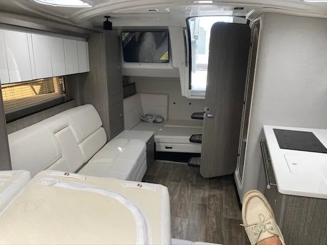 Slide: The Image of Interior of 2020 Monterey 345 SY yacht with modern furnishings and wood flooring. - 34