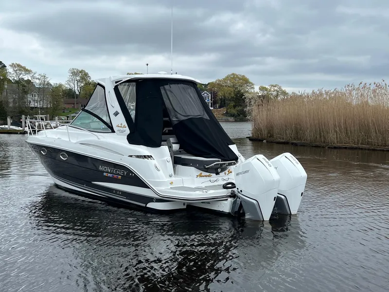 Slide: The Image of 2020 Monterey 345 SY boat on a calm lake with overcast skies. - 4