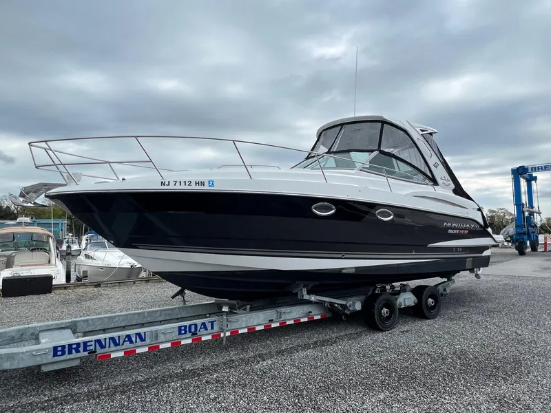 Slide: The Image of 2020 Monterey 345 SY boat on trailer at marina under cloudy sky. - 40
