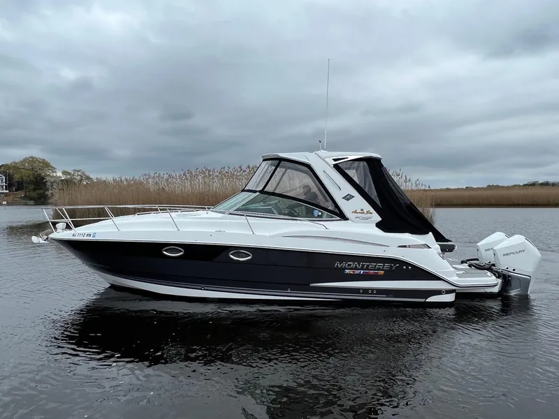 Slide: The Image of 2020 Monterey 345 SY boat on calm water under cloudy skies. - 5