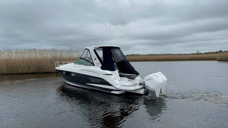 Slide: The Image of 2020 Monterey 345 SY boat on calm water under cloudy skies. - 8
