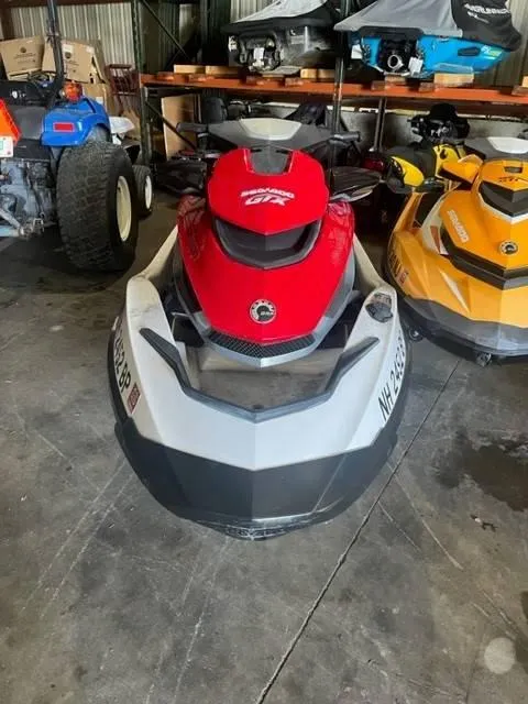 Slide: The Image of 2011 Sea-Doo GXT iS 215 jet ski in storage, front view. - 3