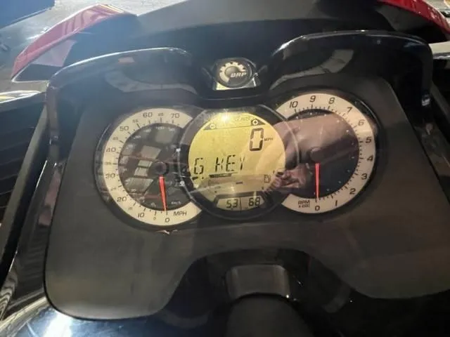 Slide: The Image of 2011 Sea-Doo GXT iS 215 dashboard displaying speedometer and digital screen. - 4