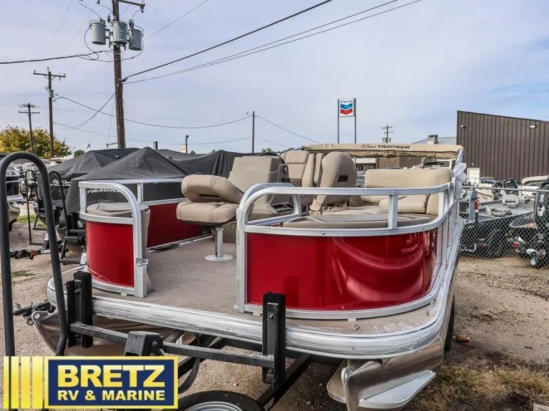 Slide: The Image of 2025 BASS BUGGY 18 DLX pontoon boat in dealership lot. - 4