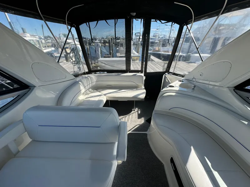 Slide: The Image of 2008 Bayliner 300 Ciera interior with white seating and panoramic windows. - 10