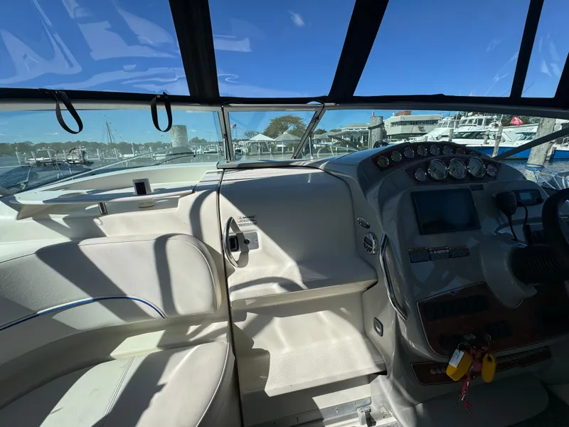 Slide: The Image of Interior view of 2008 Bayliner 300 Ciera boat cockpit with dashboard and seating. - 14