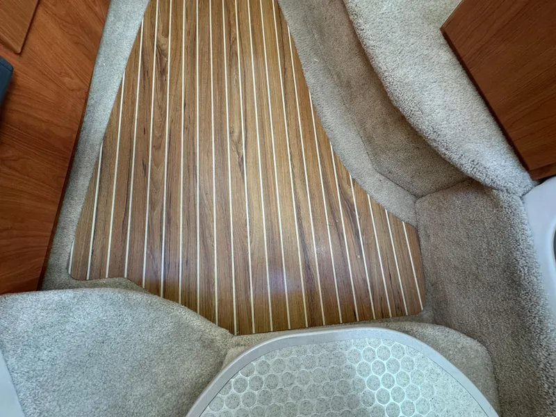 Slide: The Image of Interior view of 2008 Bayliner 300 Ciera with wood flooring and carpeted sides. - 23