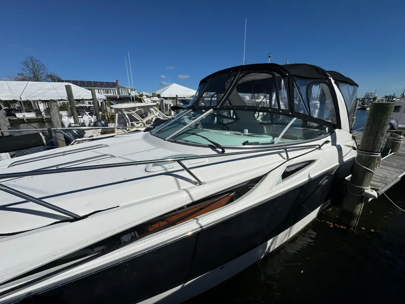 Slide: The Image of 2008 Bayliner 300 Ciera boat docked at marina under clear blue sky. - 3