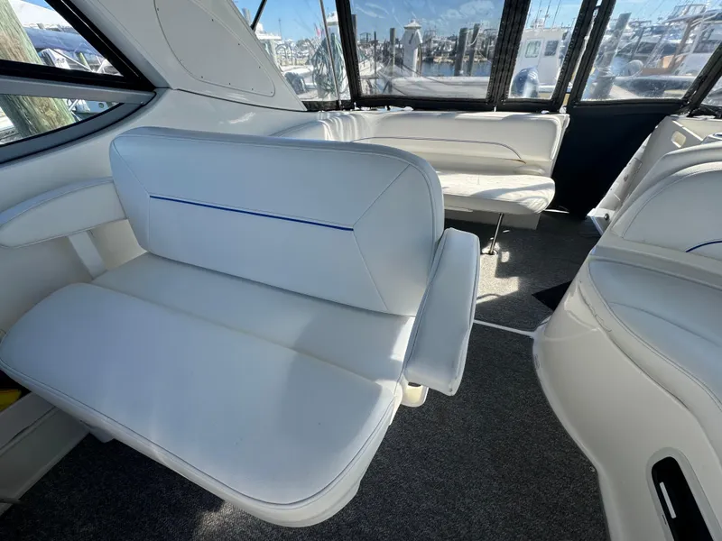 Slide: The Image of Interior of 2008 Bayliner 300 Ciera with white seating and large windows. - 9