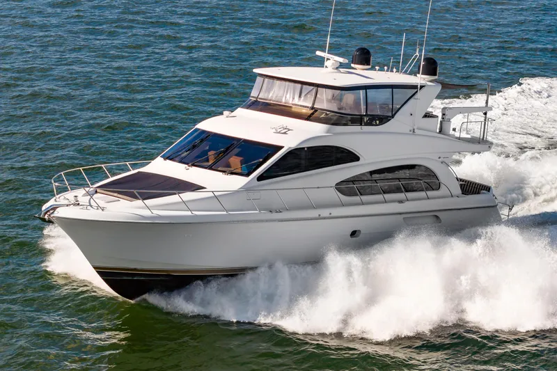 Slide: The Image of 2007 Hatteras 64 Motor Yacht cruising on open water. - 2