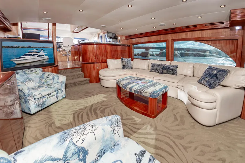 Slide: The Image of Luxurious interior of 2007 Hatteras 64 Motor Yacht with elegant seating and decor. - 25