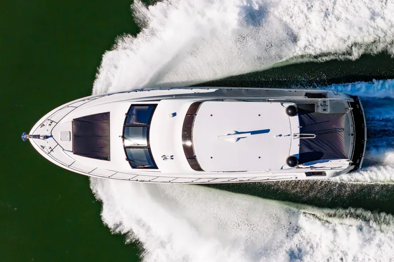 Slide: The Image of Aerial view of 2007 Hatteras 64 Motor Yacht cruising on water. - 3