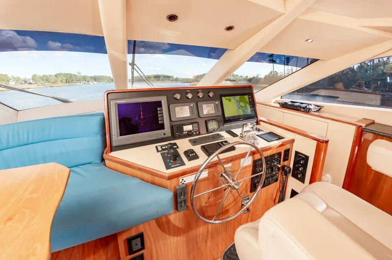 Slide: The Image of Interior helm of 2007 Hatteras 64 Motor Yacht with navigation equipment and steering wheel. - 32