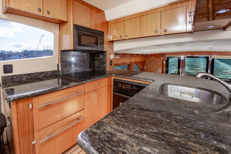 Slide: The Image of Luxurious kitchen interior of 2007 Hatteras 64 Motor Yacht with granite countertops. - 37