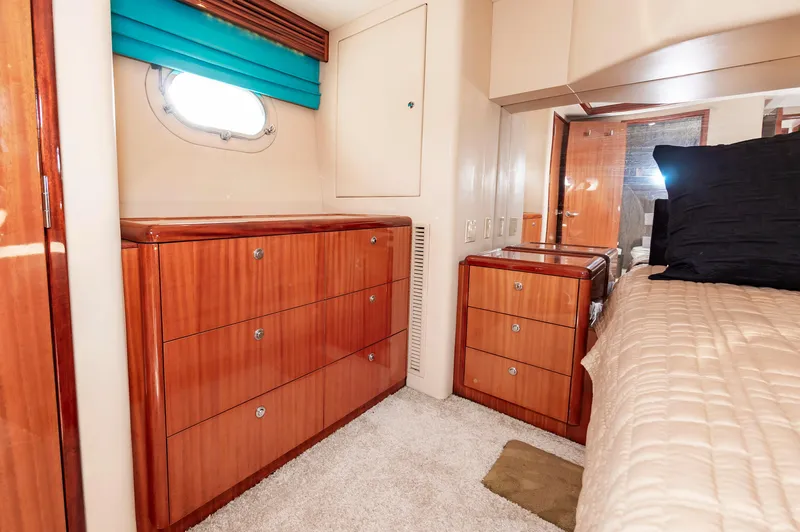 Slide: The Image of Luxurious 2007 Hatteras 64 Motor Yacht bedroom with elegant wood cabinetry. - 45