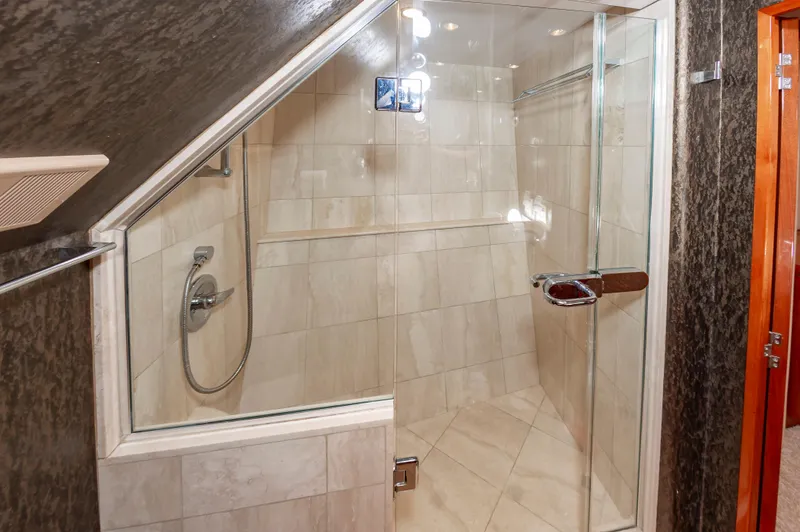 Slide: The Image of Luxurious glass shower in 2007 Hatteras 64 Motor Yacht bathroom. - 48