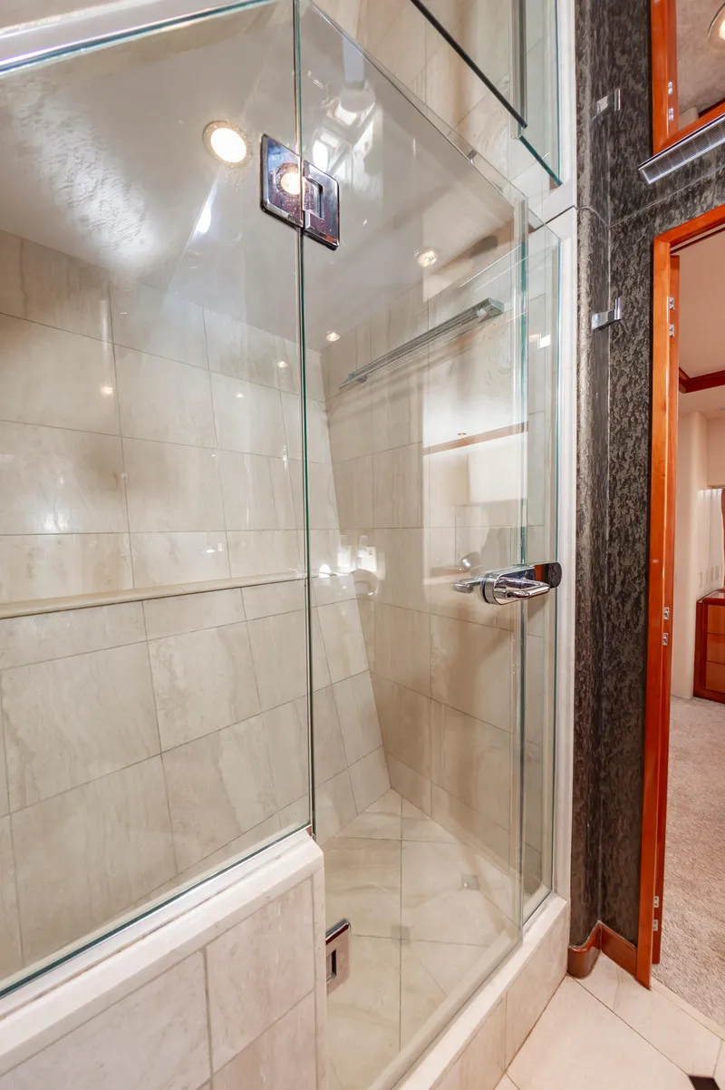 Slide: The Image of Luxurious glass shower in 2007 Hatteras 64 Motor Yacht bathroom. - 49