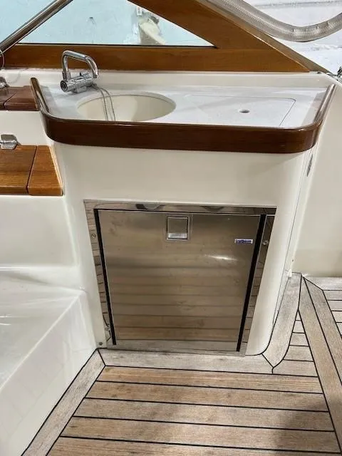 Slide: The Image of 2016 Hunt Yachts Harrier interior with sink and stainless steel cabinet. - 10