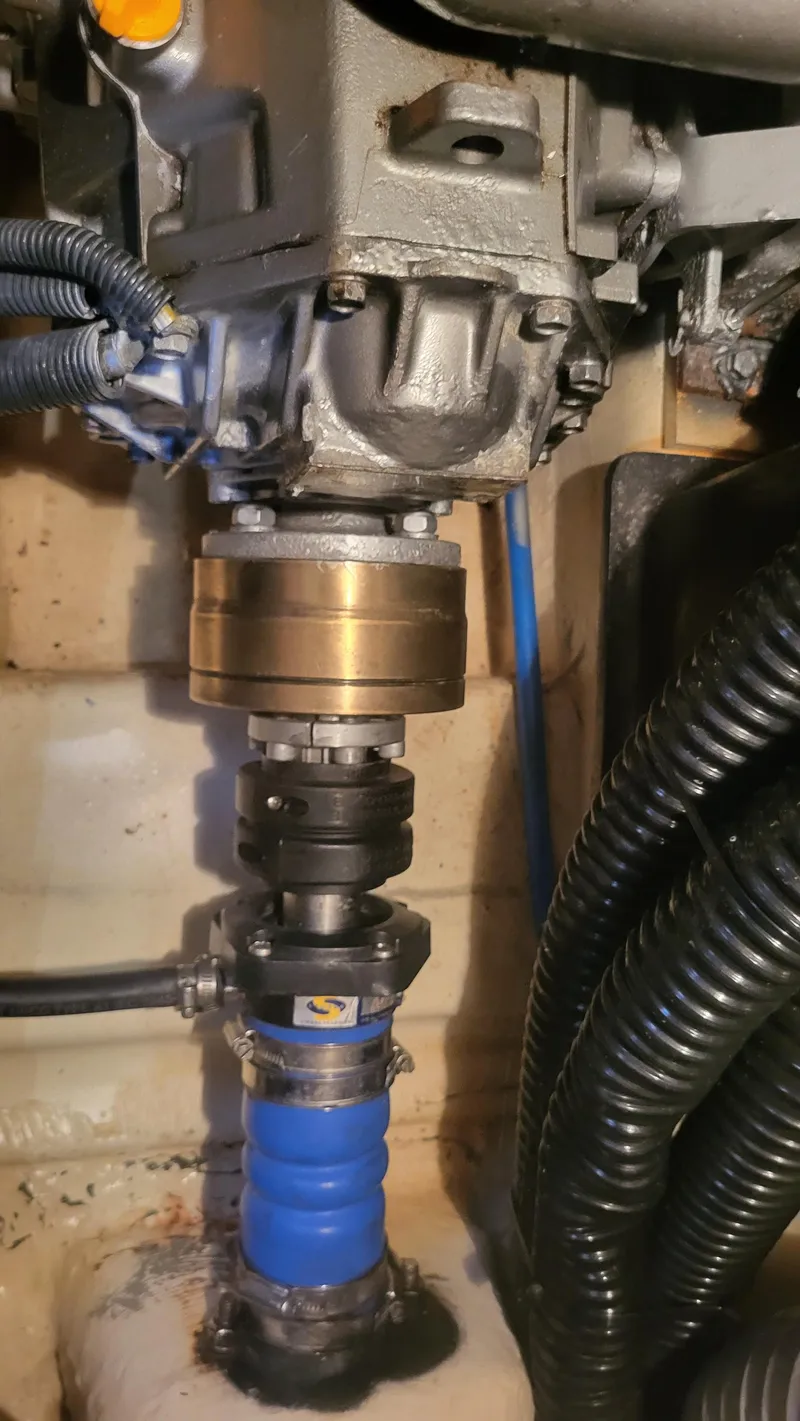 Slide: The Image of Close-up of a 2009 Hunter 50 CC engine component with blue hose and wiring. - 14