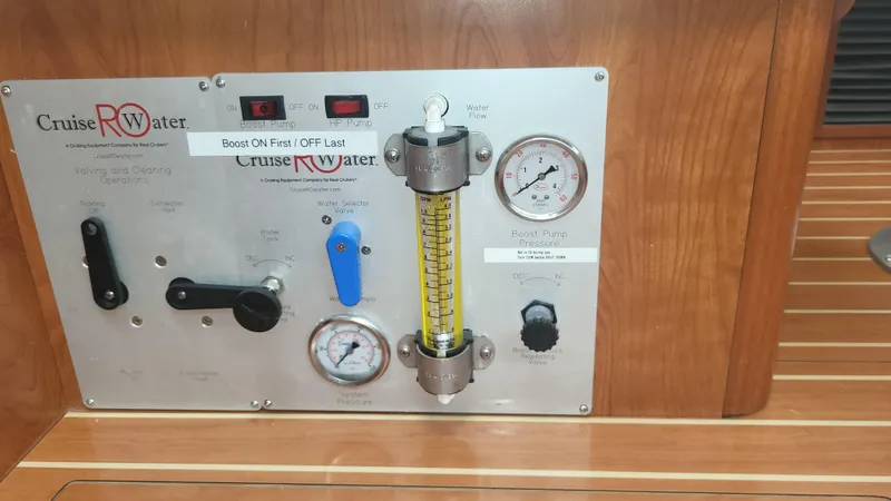 Slide: The Image of Control panel on a 2009 Hunter 50 CC boat with gauges and switches. - 18