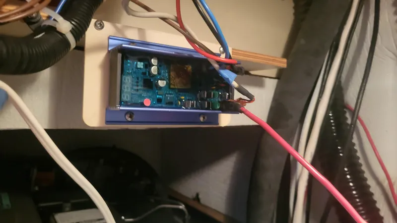 Slide: The Image of Electronic circuit board with wires in a 2009 Hunter 50 CC vehicle. - 28