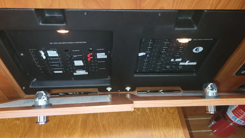 Slide: The Image of Electrical control panels on a 2009 Hunter 50 CC yacht interior. - 44