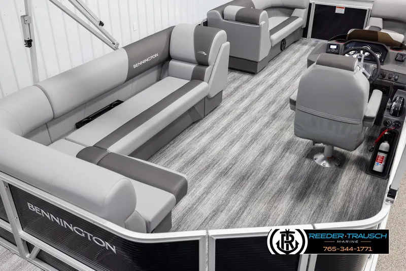 Slide: The Image of Interior of 2025 Bennington 21 SLSE pontoon boat with gray seating and modern design. - 12