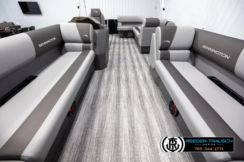 Slide: The Image of Interior of 2025 Bennington 21 SLSE pontoon boat with gray seating and modern design. - 13