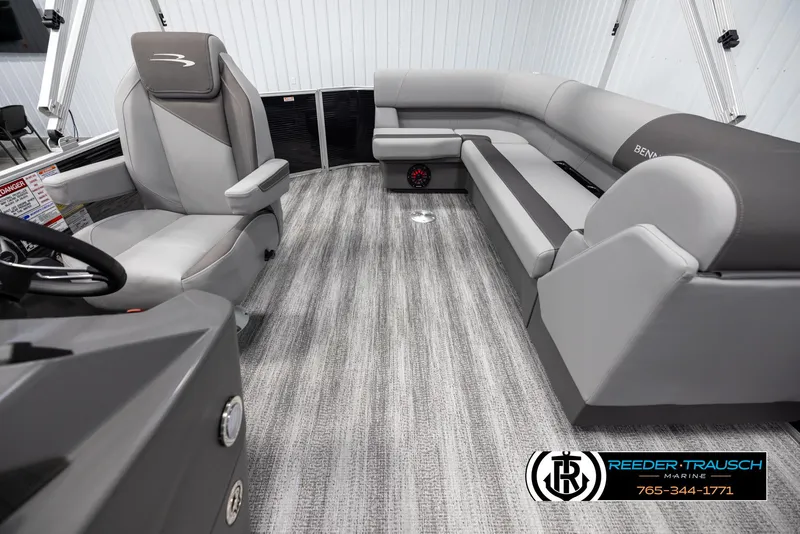 Slide: The Image of Interior of 2025 Bennington 21 SLSE pontoon boat with gray seating and modern design. - 14