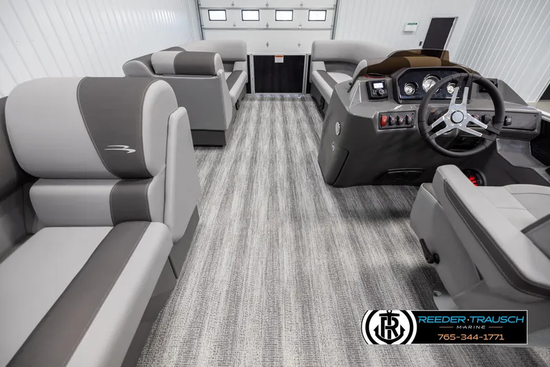 Slide: The Image of 2025 Bennington 21 SLSE pontoon boat interior with modern seating and steering console. - 17