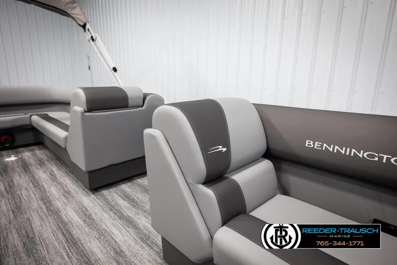 Slide: The Image of 2025 Bennington 21 SLSE pontoon boat interior with gray seating and logo. - 20