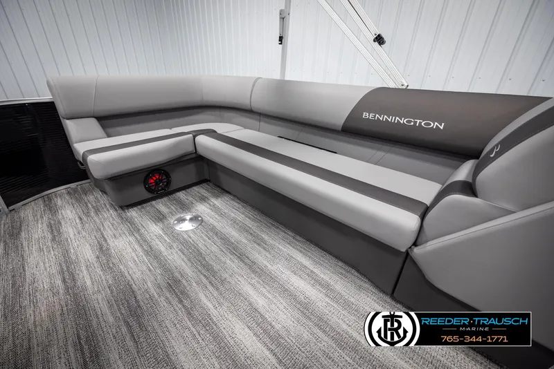 Slide: The Image of 2025 Bennington 21 SLSE pontoon boat interior with gray seating and carpeted flooring. - 22