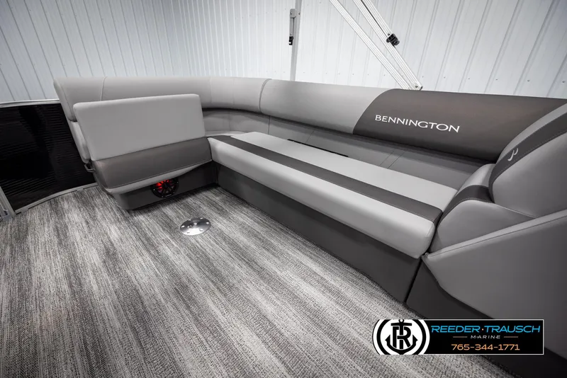 Slide: The Image of 2025 Bennington 21 SLSE pontoon boat interior with gray seating and carpet flooring. - 24